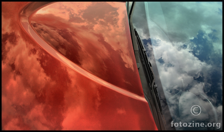 sky in red car