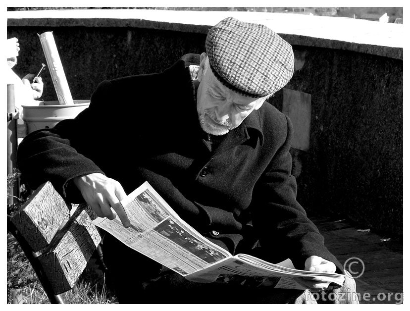 Man with newspapers