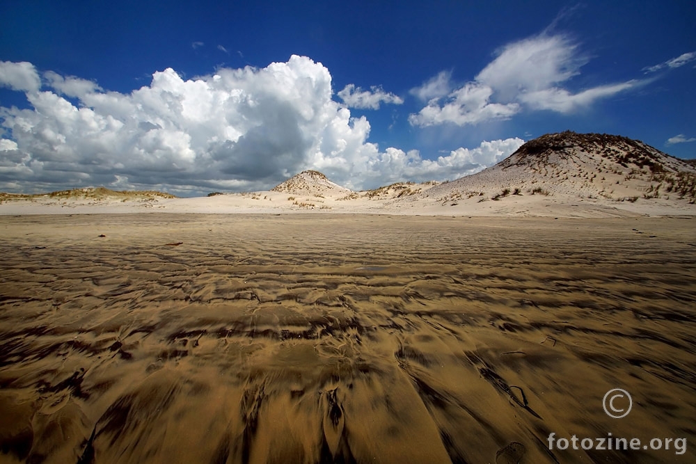 Attraction of Sand and Clouds